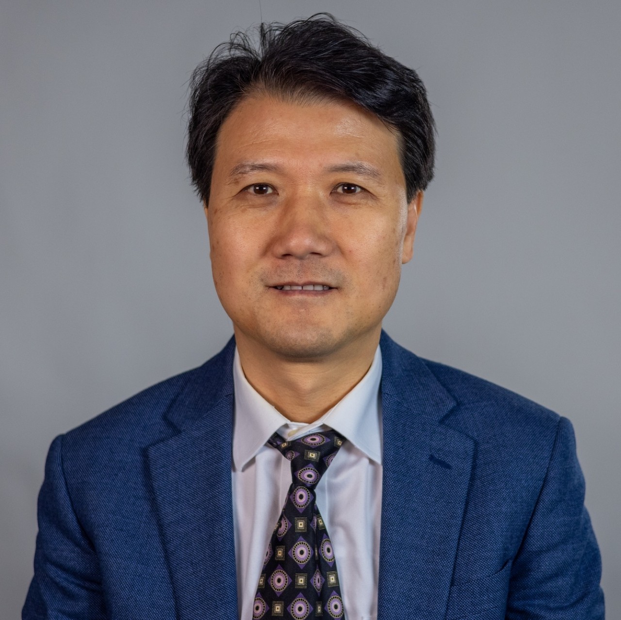 Headshot of Justin Zhan