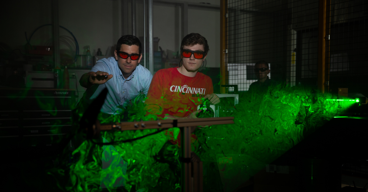 student with laser