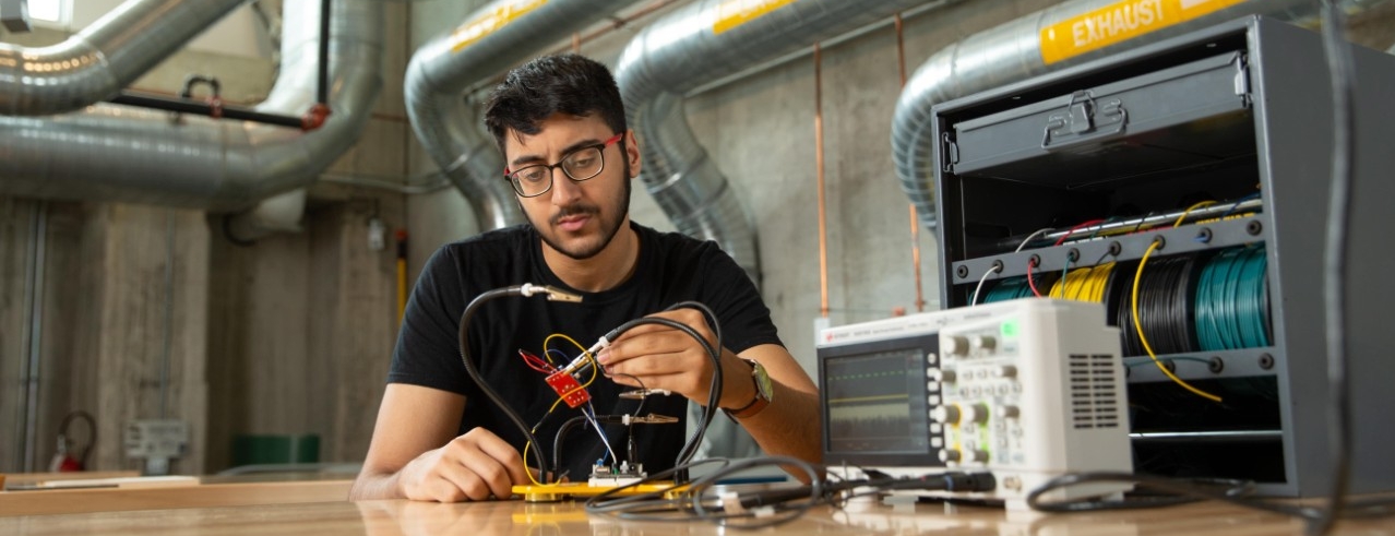 Students working on electrical item
