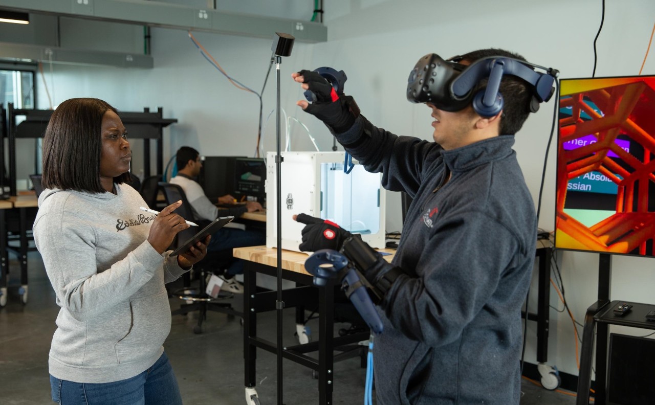 College of Engineering and Applied Science (CEAS) graduate students pose at the Digital Futures building.
