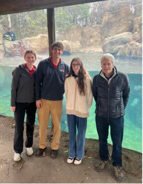 Students stand in front of the hippo exhibit at the Cincinnati Zoo