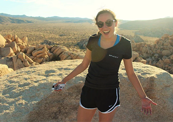 McKenzie Kinzbach, aerospace engineering class of 2018, on co-op at SpaceX in Hawthorne, California, with a desert in the background