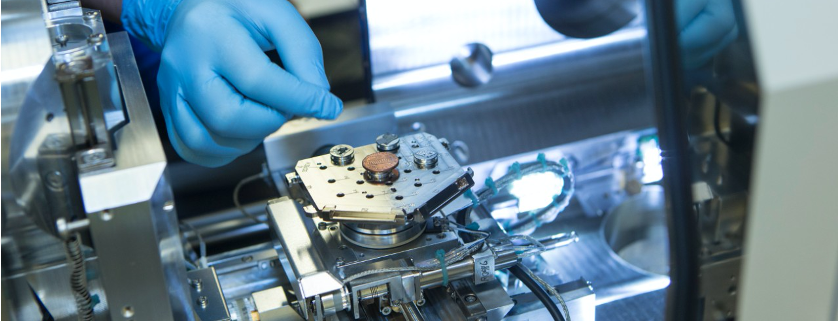 Person manipulating a microscope