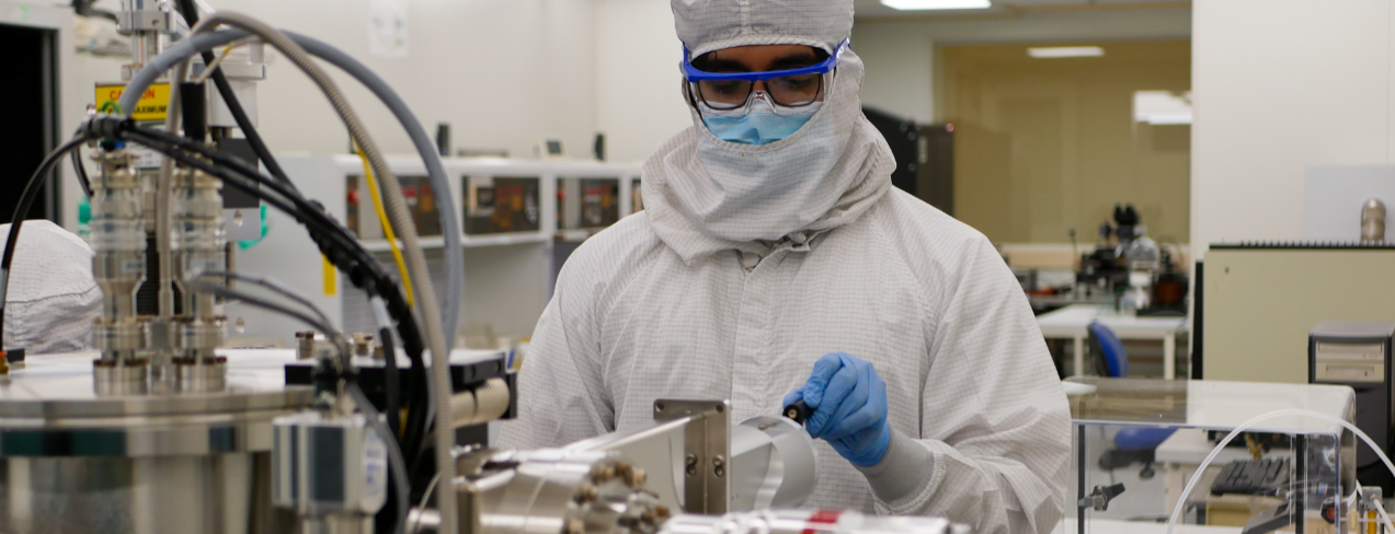 A person in the Cleanroom working with equipment