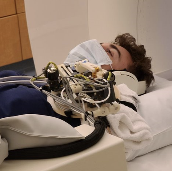 Student in MRI machine